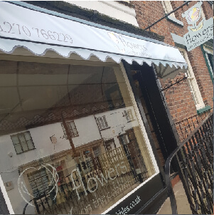 canopy, swing sign and window graphics